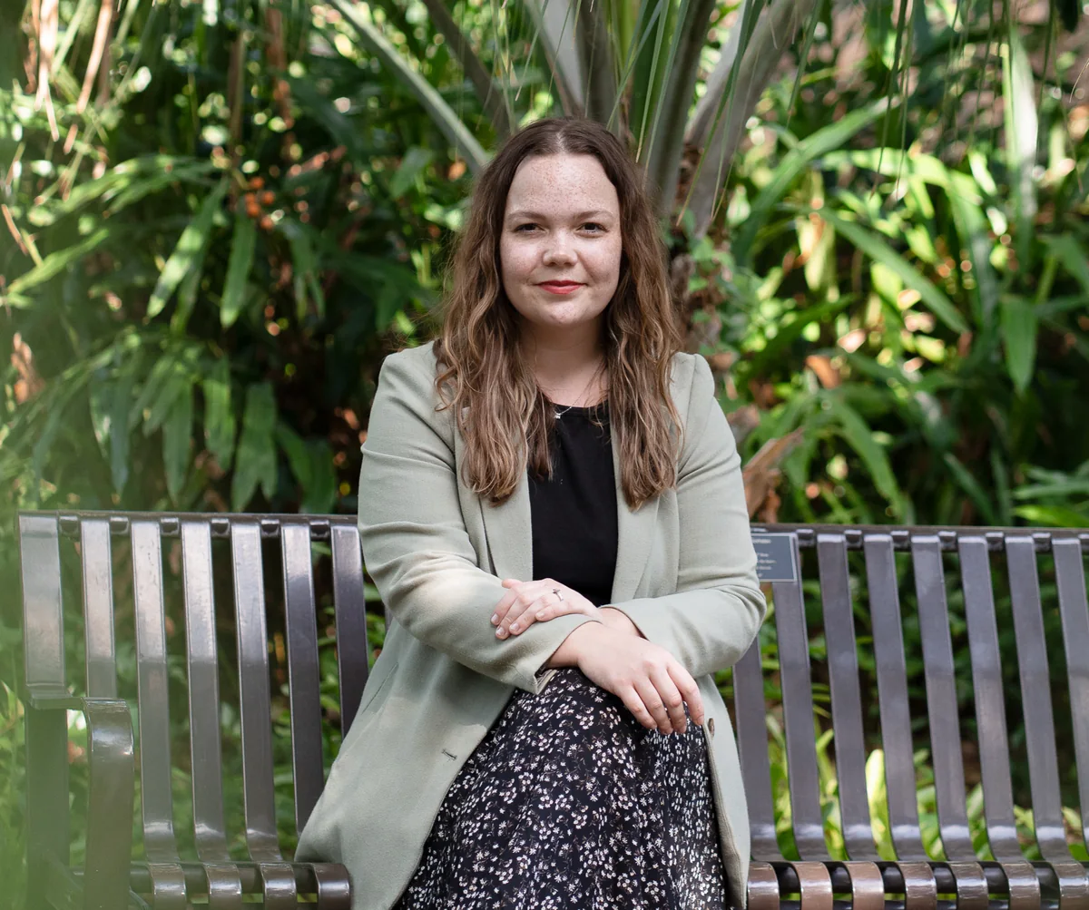 Mulberry Media founder Allison Martinous-van Tilborgh seated outdoors in a garden